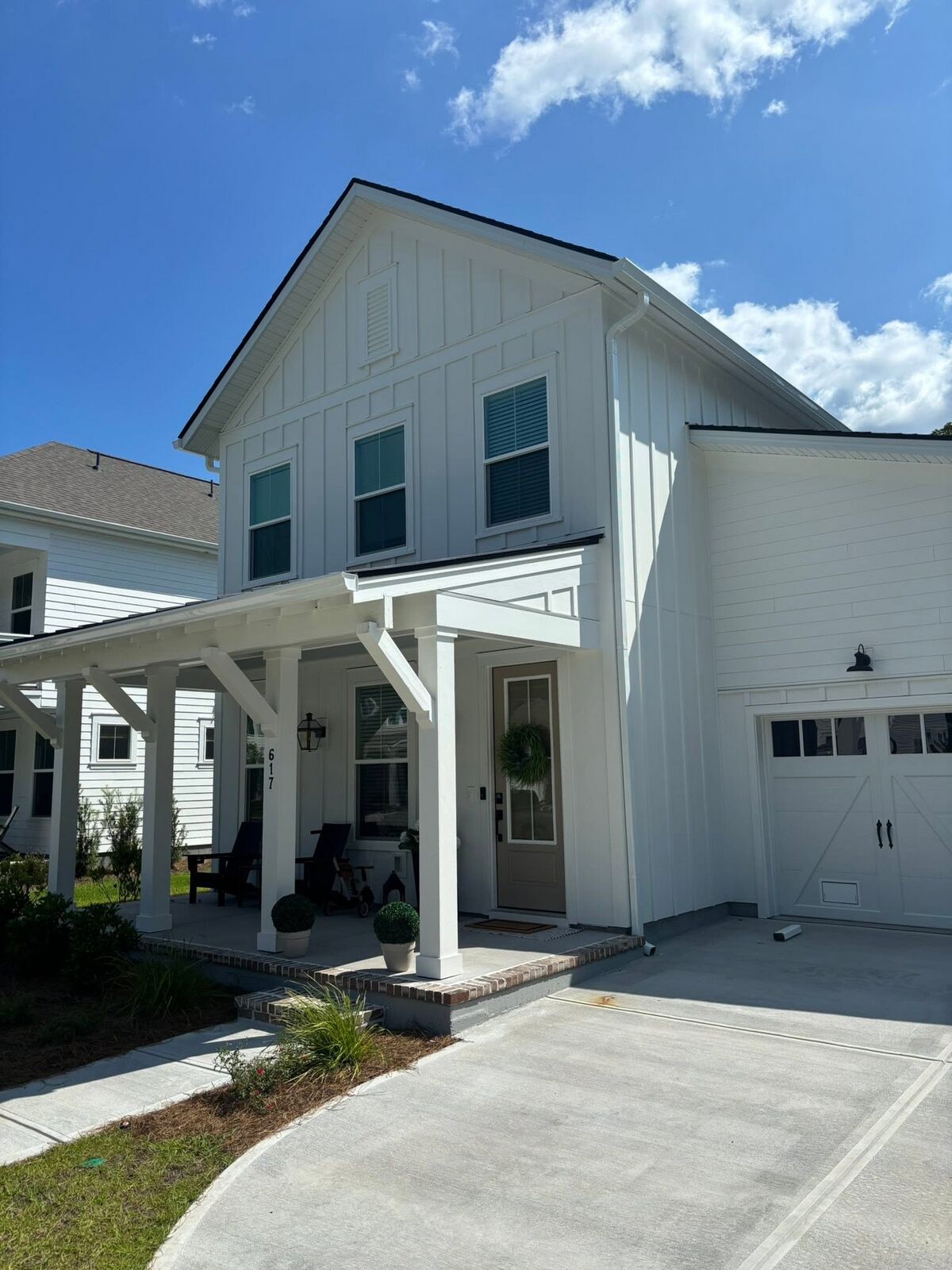 White seamless gutters on a two-story modern farmhouse